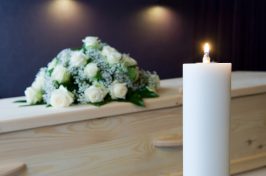 candle and wooden coffin